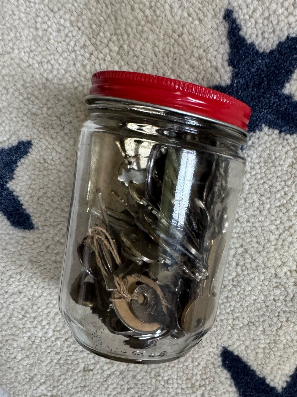 Vintage Red-Lidded Glass Jar with Metal Charms/Keys